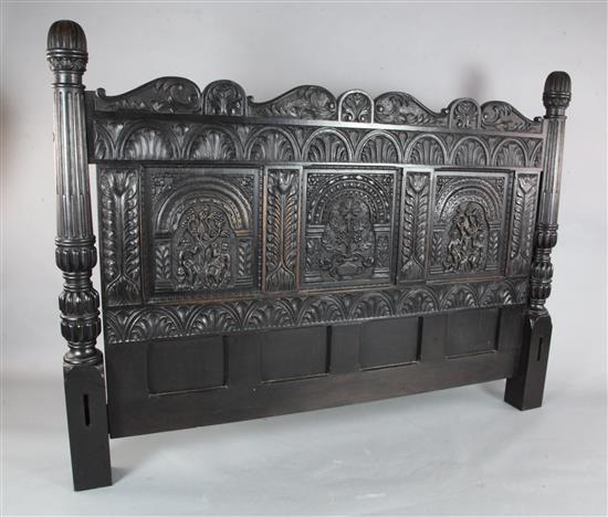 A 17th century style ebonised oak bedstead, W.6ft 10in. D.7ft 4in. H.4ft approx.